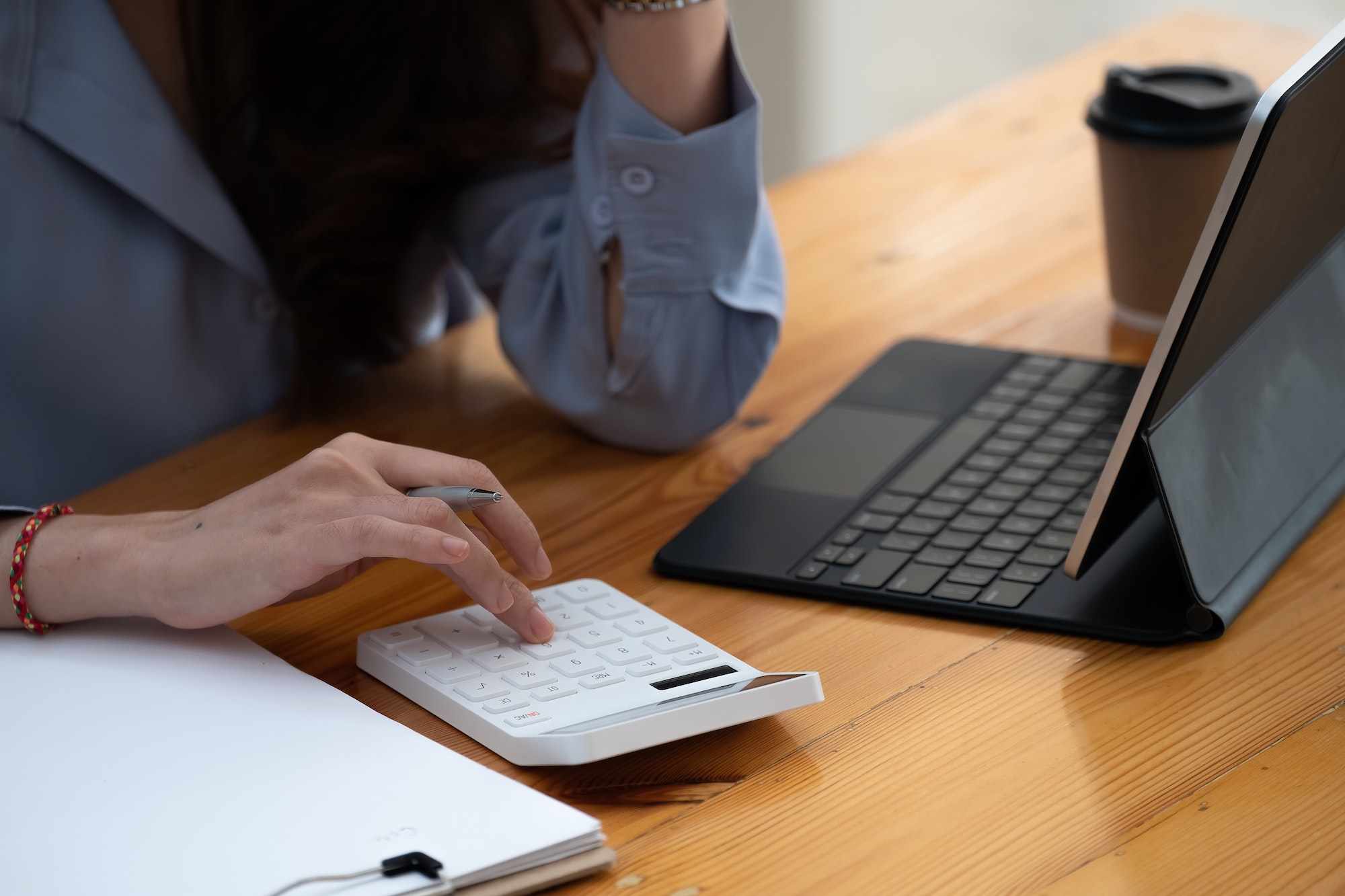 businessman working using calculator with laptop in office - accounting concept.