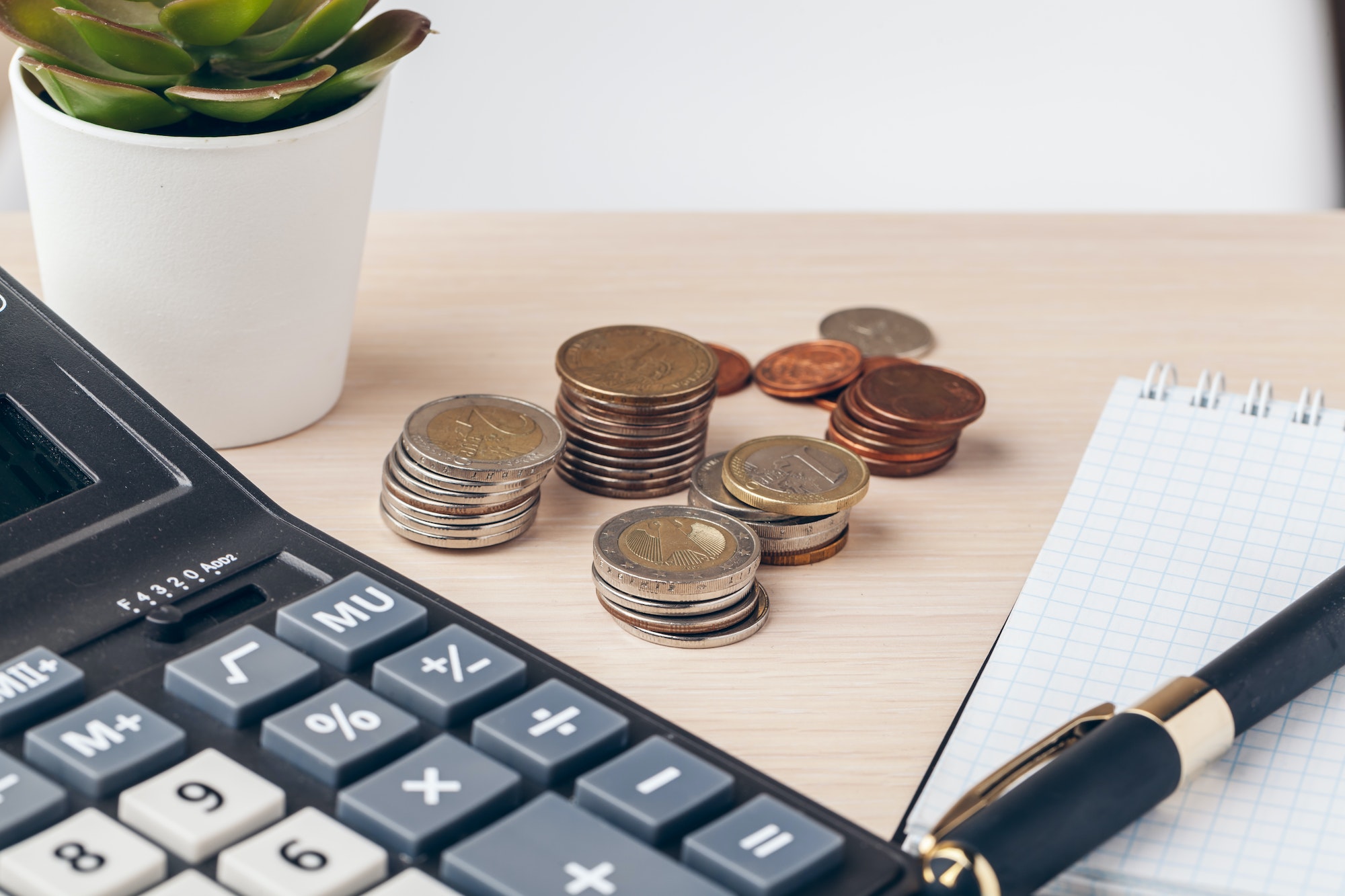The close-up of accounting documents with money coins